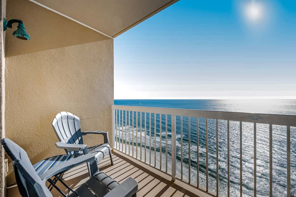 Tropical, waterfront oasis with furnished balcony, pools, & beach access