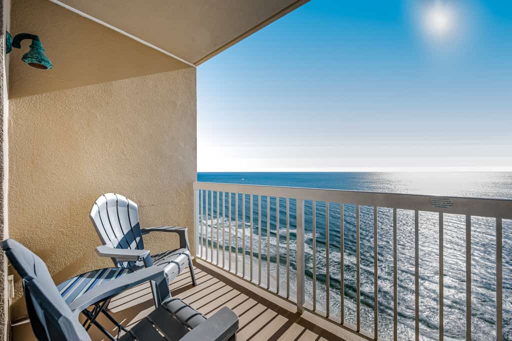 Tropical, waterfront oasis with furnished balcony, pools, & beach access