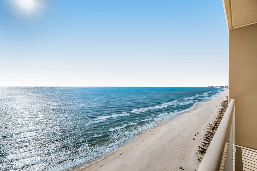 Tropical, waterfront oasis with furnished balcony, pools, & beach access