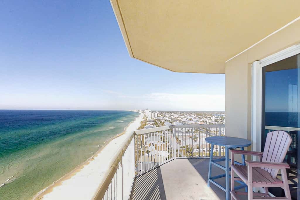 Chic & stylish beachfront condo with wraparound balcony, pools, & gym