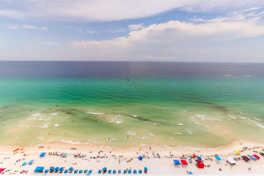 Beachfront, seafoam sanctuary with furnished balcony, pools, & gym