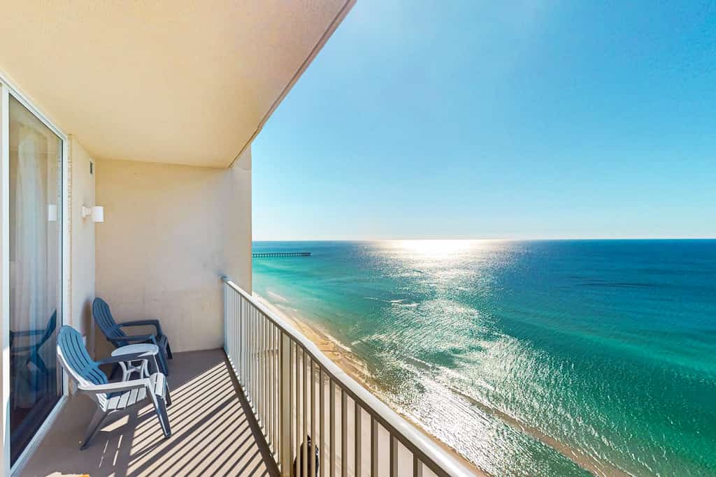 Gulf-front getaway with water views, pools, hot tub, game room & gym