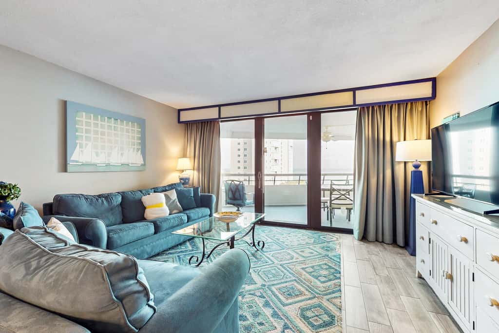 8th floor condo with Gulf views, balcony, pools, hot tubs, central AC, and WiFi