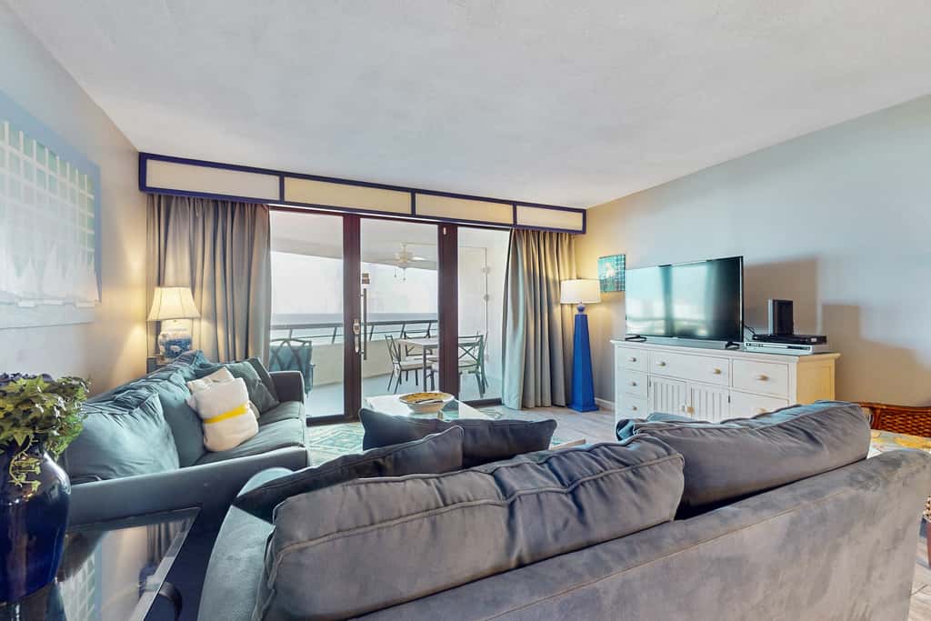8th floor condo with Gulf views, balcony, pools, hot tubs, central AC, and WiFi