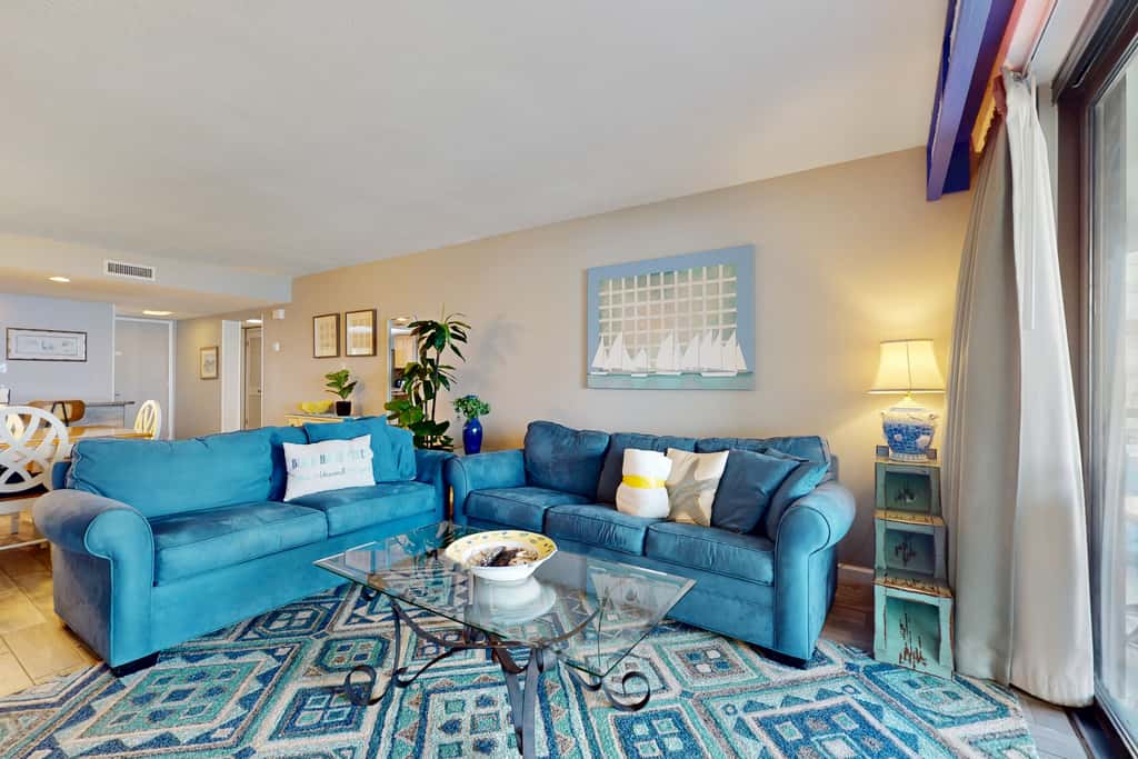 8th floor condo with Gulf views, balcony, pools, hot tubs, central AC, and WiFi
