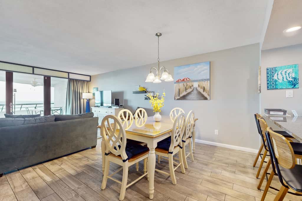 8th floor condo with Gulf views, balcony, pools, hot tubs, central AC, and WiFi