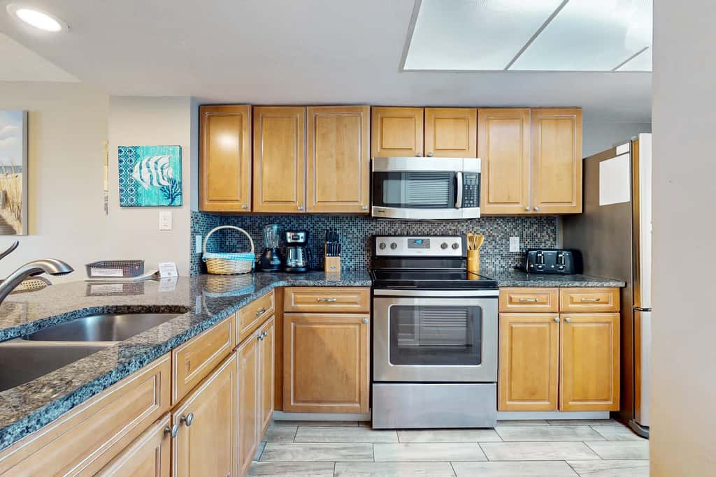 8th floor condo with Gulf views, balcony, pools, hot tubs, central AC, and WiFi