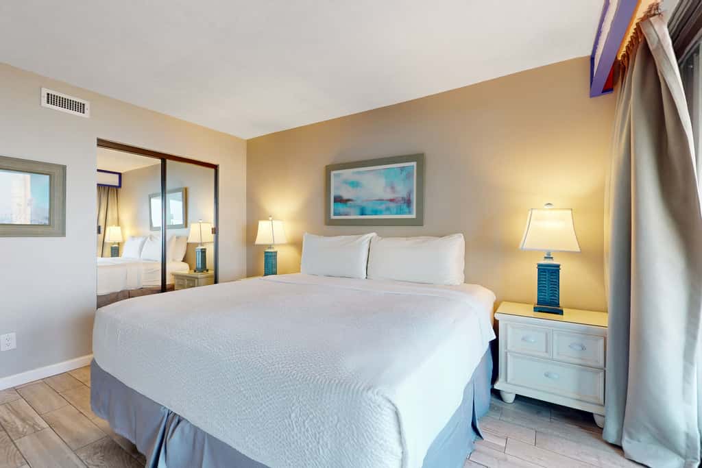 8th floor condo with Gulf views, balcony, pools, hot tubs, central AC, and WiFi