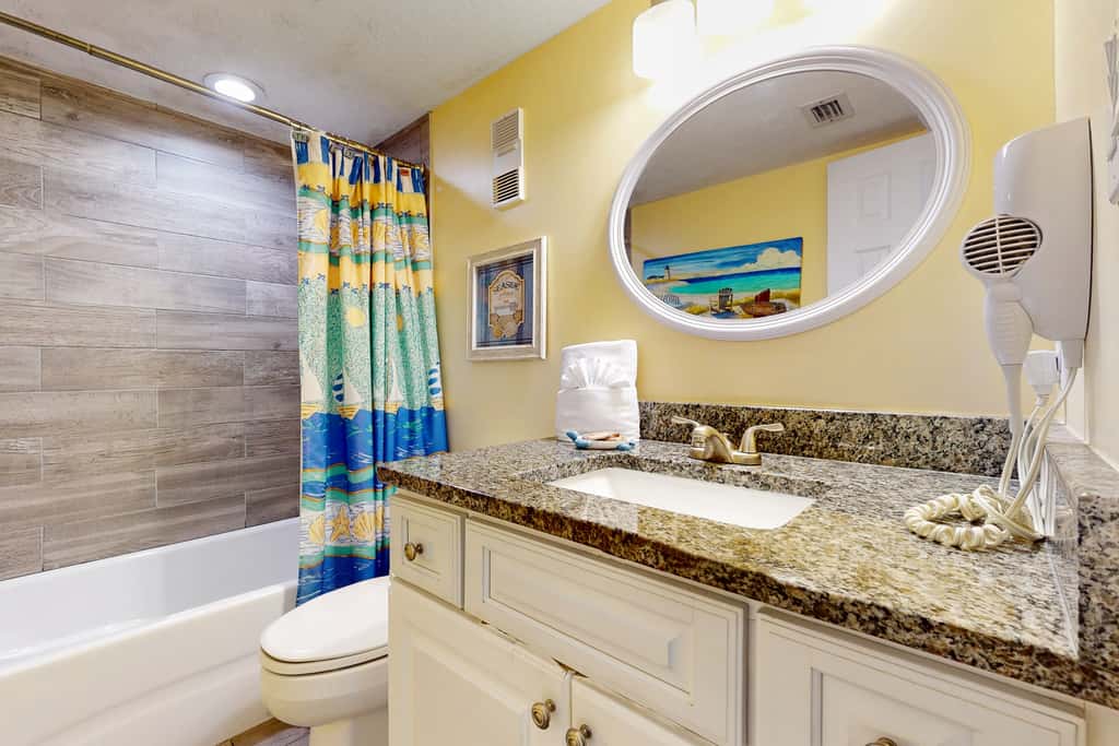 8th floor condo with Gulf views, balcony, pools, hot tubs, central AC, and WiFi