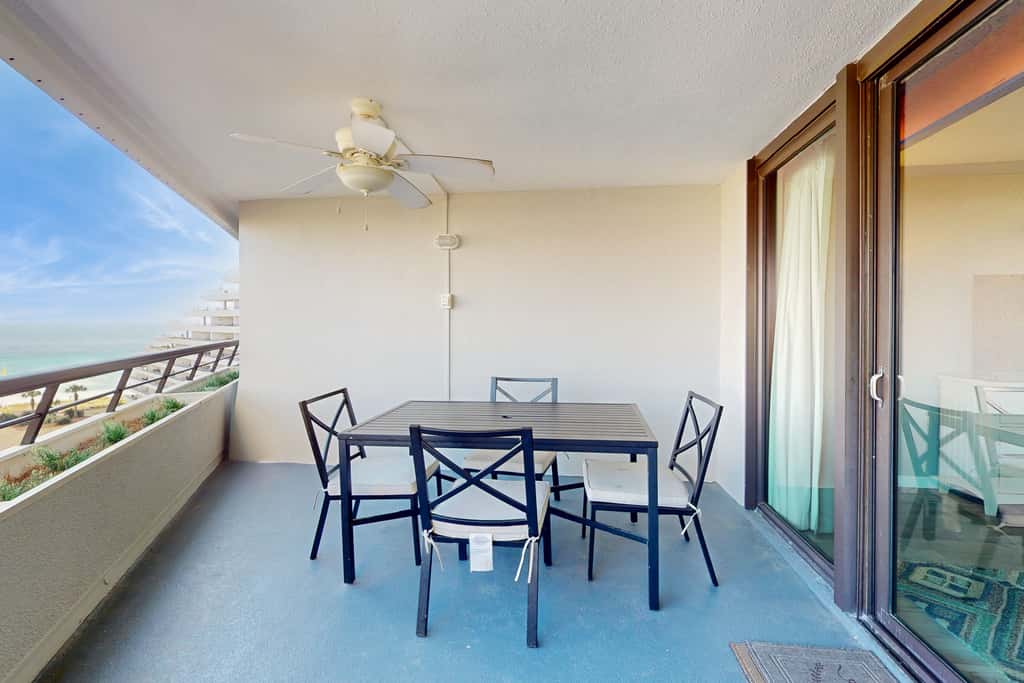 8th floor condo with Gulf views, balcony, pools, hot tubs, central AC, and WiFi