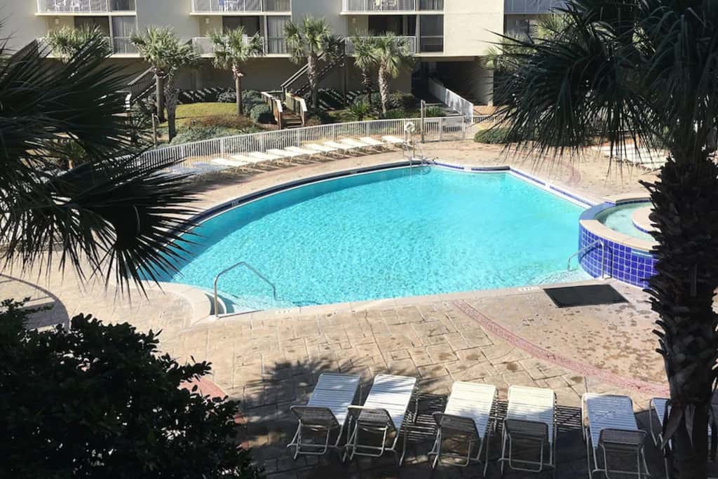 Ocean-view condo with pools & hot tub, balcony, central AC, W&D