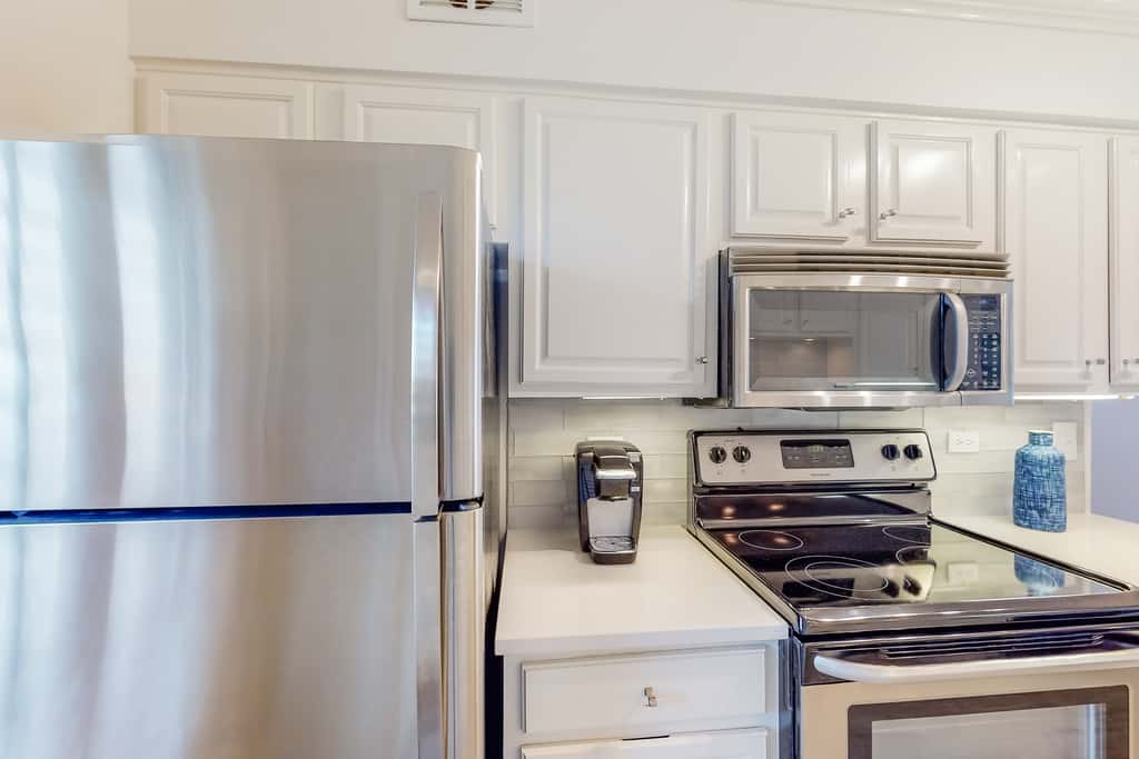Ocean-view condo with pools & hot tub, balcony, central AC, W&D
