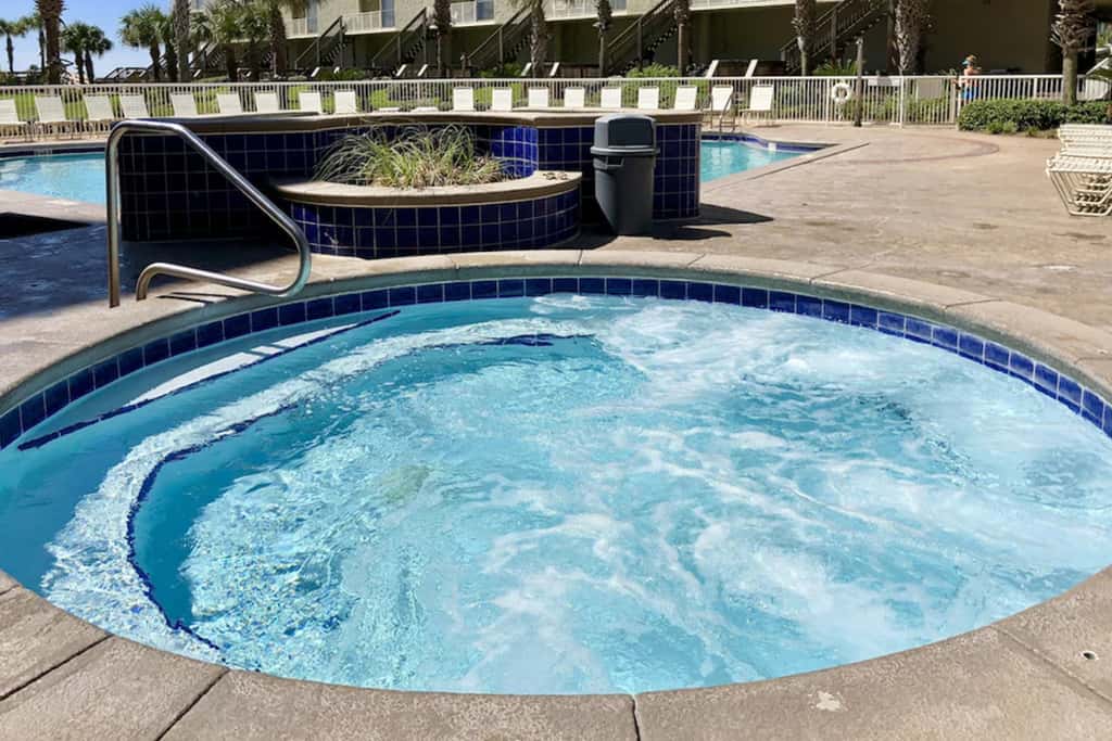 Ocean-view condo with pools & hot tub, balcony, central AC, W&D