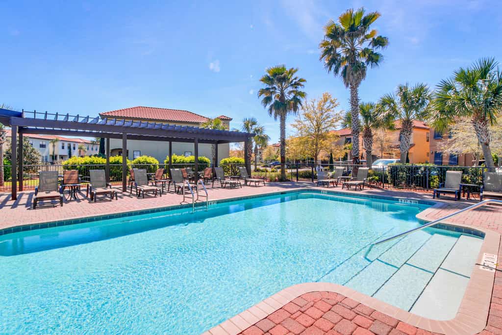Sunny getaway with 2 golf carts, patio, grill, pool,  & tennis