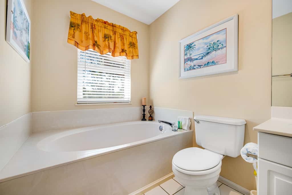 Dog-friendly townhome with golf cart, close to shops, restaurants, pools, & beach