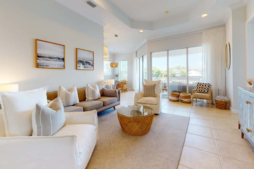 Lakefront condo with water-view balcony, private golf cart, resort pool & amenities