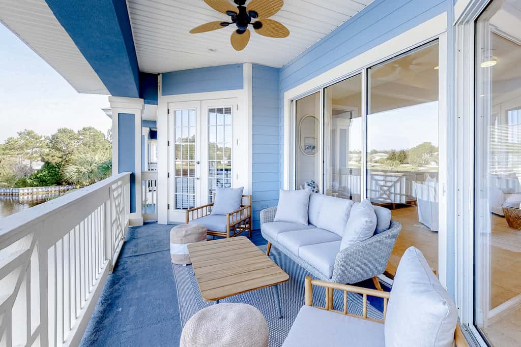 Lakefront condo with water-view balcony, private golf cart, resort pool & amenities