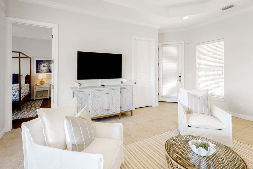 Lakefront condo with water-view balcony, private golf cart, resort pool & amenities