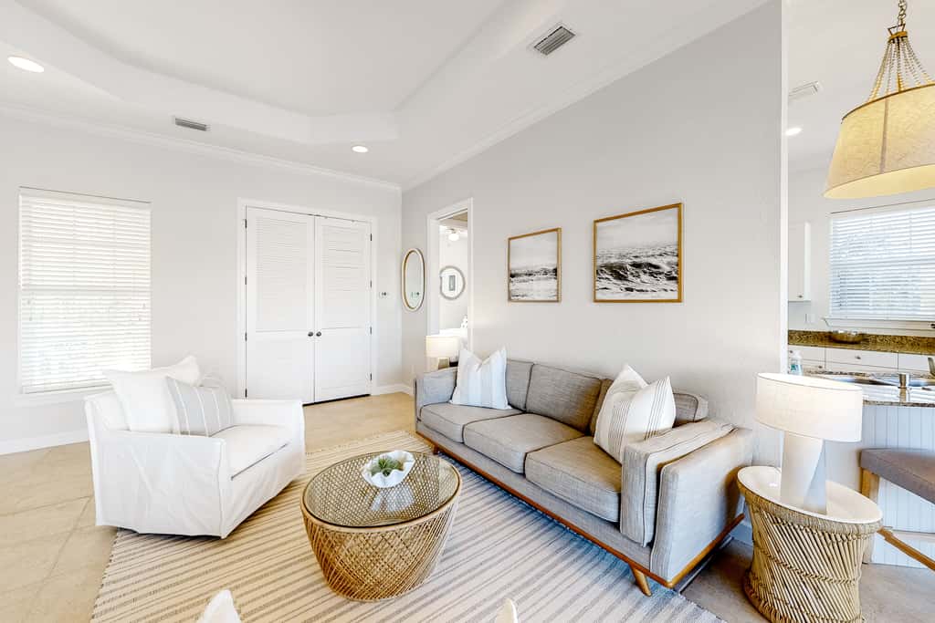 Lakefront condo with water-view balcony, private golf cart, resort pool & amenities
