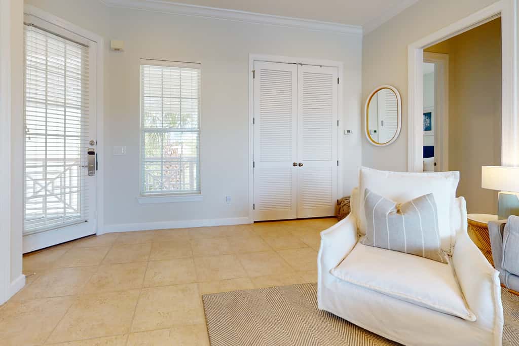 Lakefront condo with water-view balcony, private golf cart, resort pool & amenities