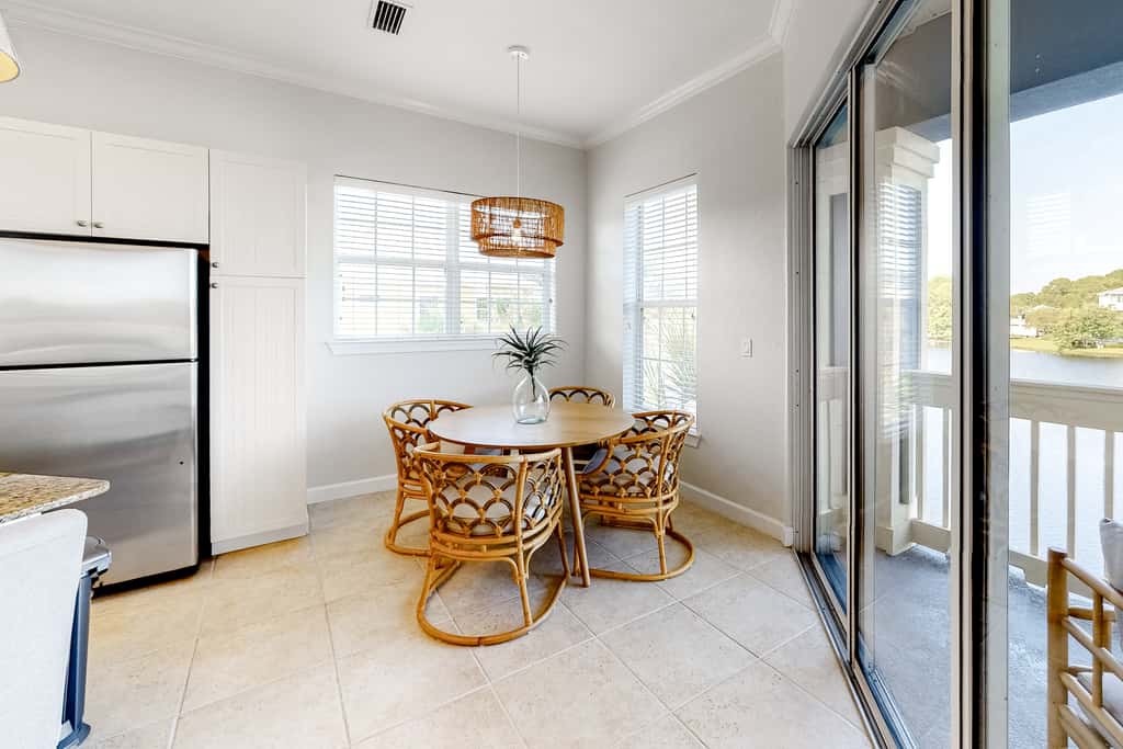 Lakefront condo with water-view balcony, private golf cart, resort pool & amenities