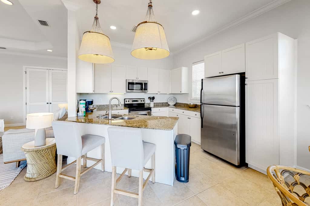 Lakefront condo with water-view balcony, private golf cart, resort pool & amenities