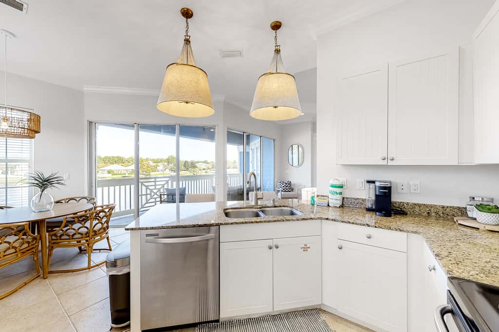 Lakefront condo with water-view balcony, private golf cart, resort pool & amenities