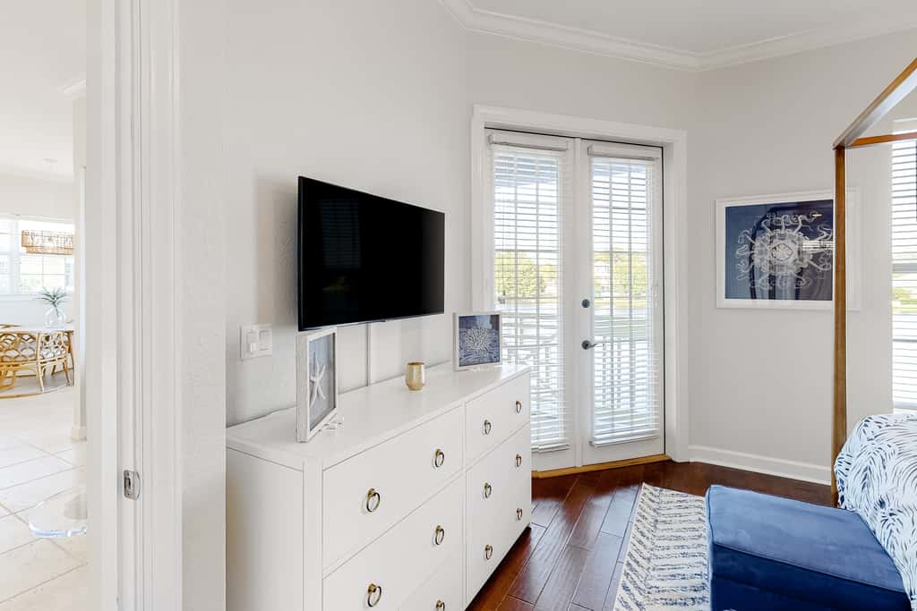 Lakefront condo with water-view balcony, private golf cart, resort pool & amenities