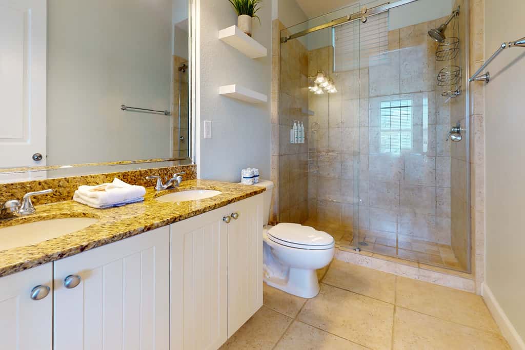 Lakefront condo with water-view balcony, private golf cart, resort pool & amenities