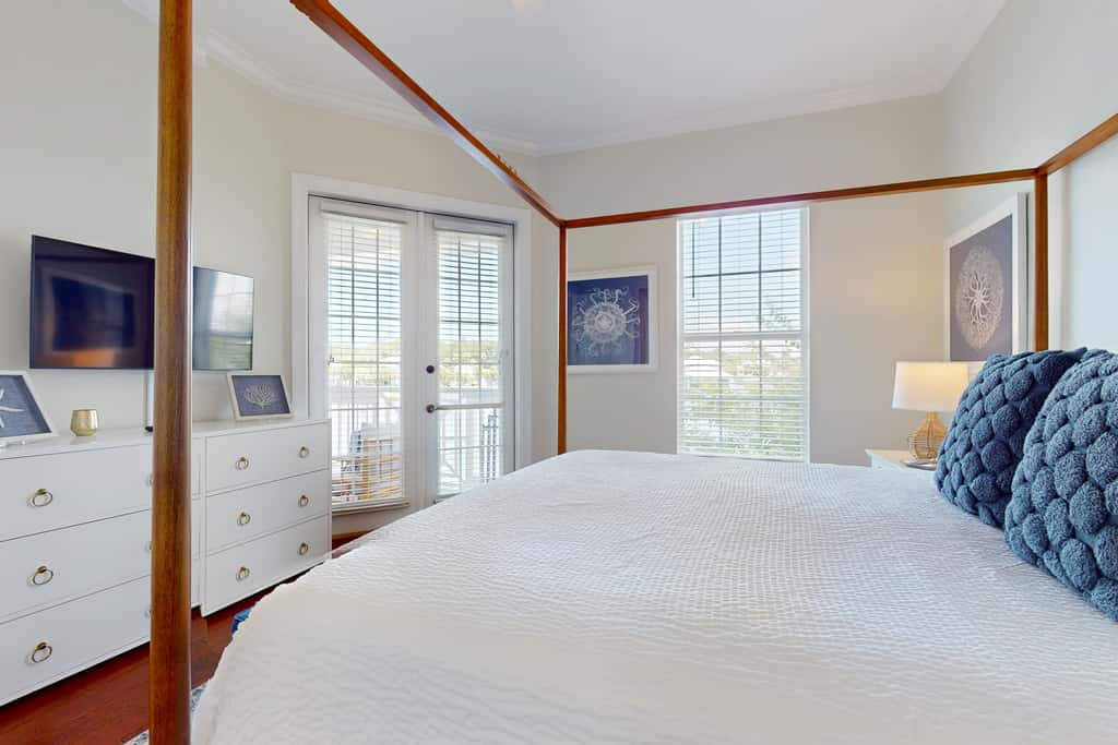 Lakefront condo with water-view balcony, private golf cart, resort pool & amenities