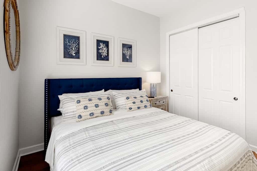 Lakefront condo with water-view balcony, private golf cart, resort pool & amenities