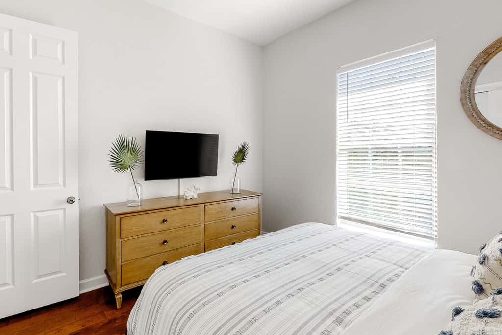 Lakefront condo with water-view balcony, private golf cart, resort pool & amenities