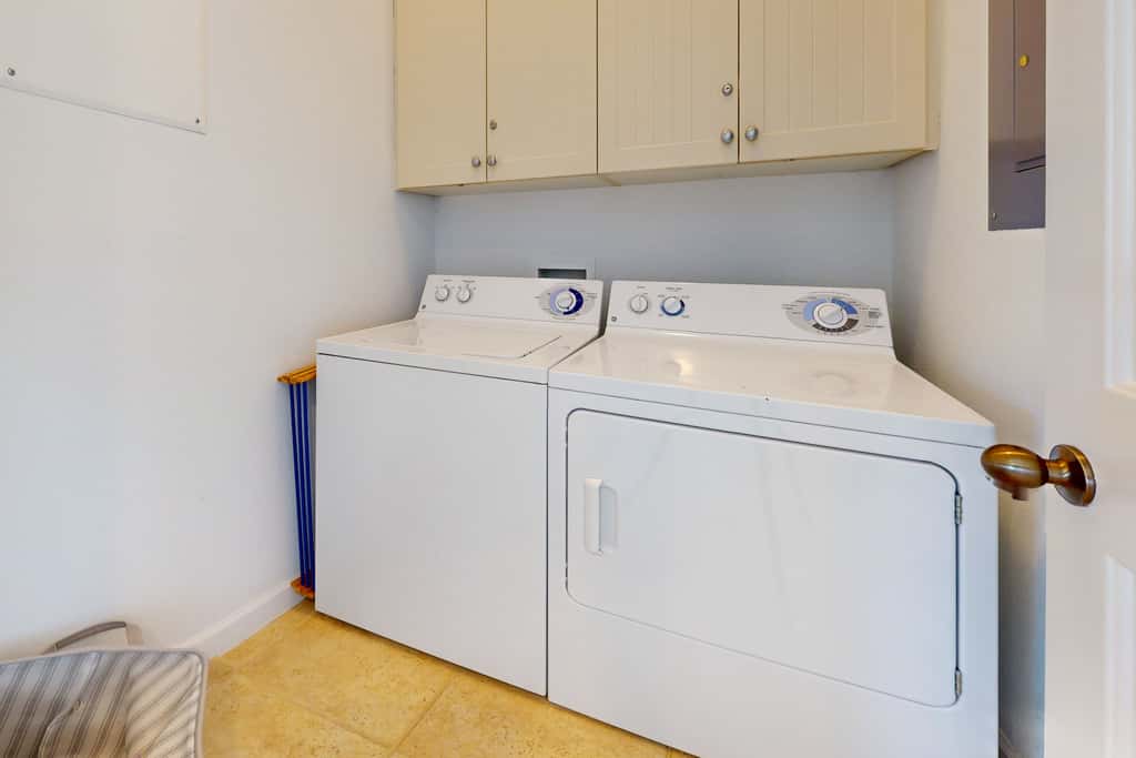 Lakefront condo with water-view balcony, private golf cart, resort pool & amenities