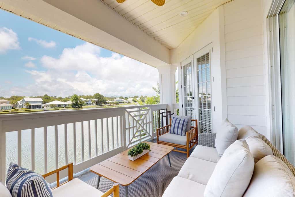 Lakefront condo with water-view balcony, private golf cart, resort pool & amenities