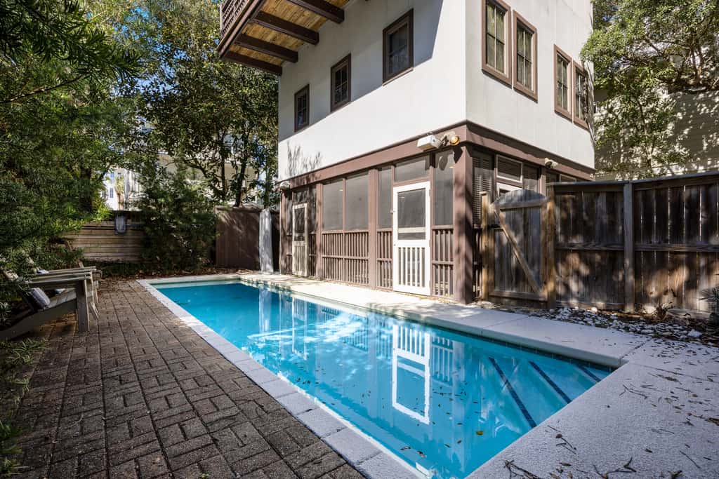 Home steps from the beach with plunge pool, gas grill, scenic balcony, & AC