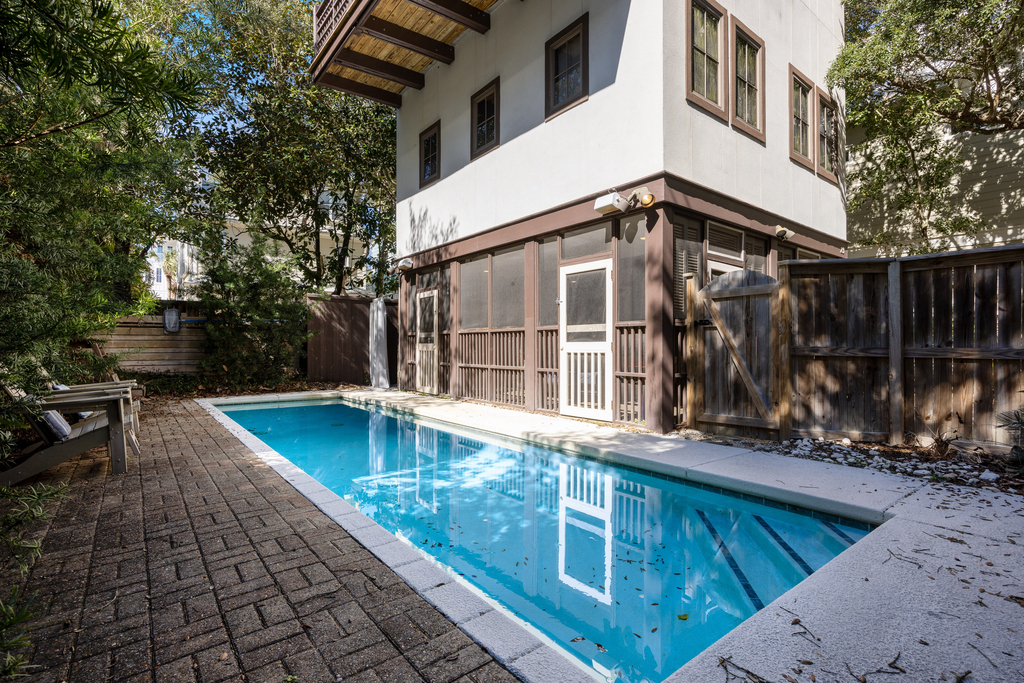 Home steps from the beach with plunge pool, gas grill, scenic balcony, & AC
