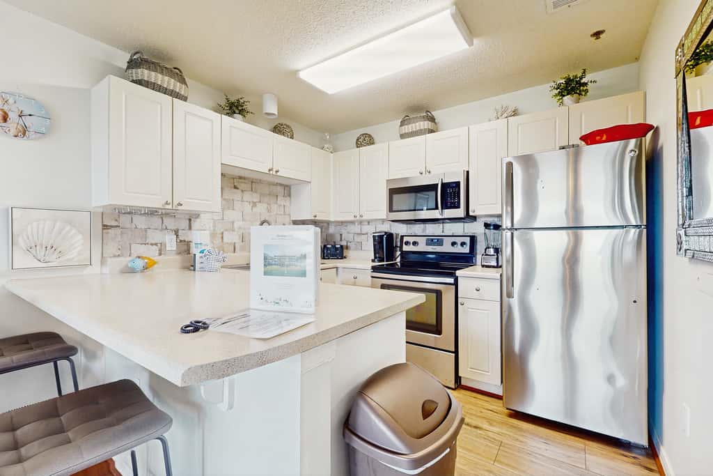 Fourth-floor, Caribbean corner condo with ocean views, pool, & hot tub