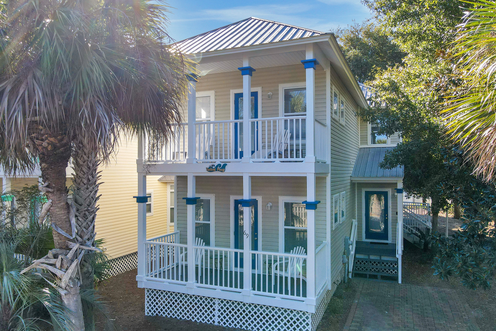 Two-story home near the beach with private balconies & on-site pool