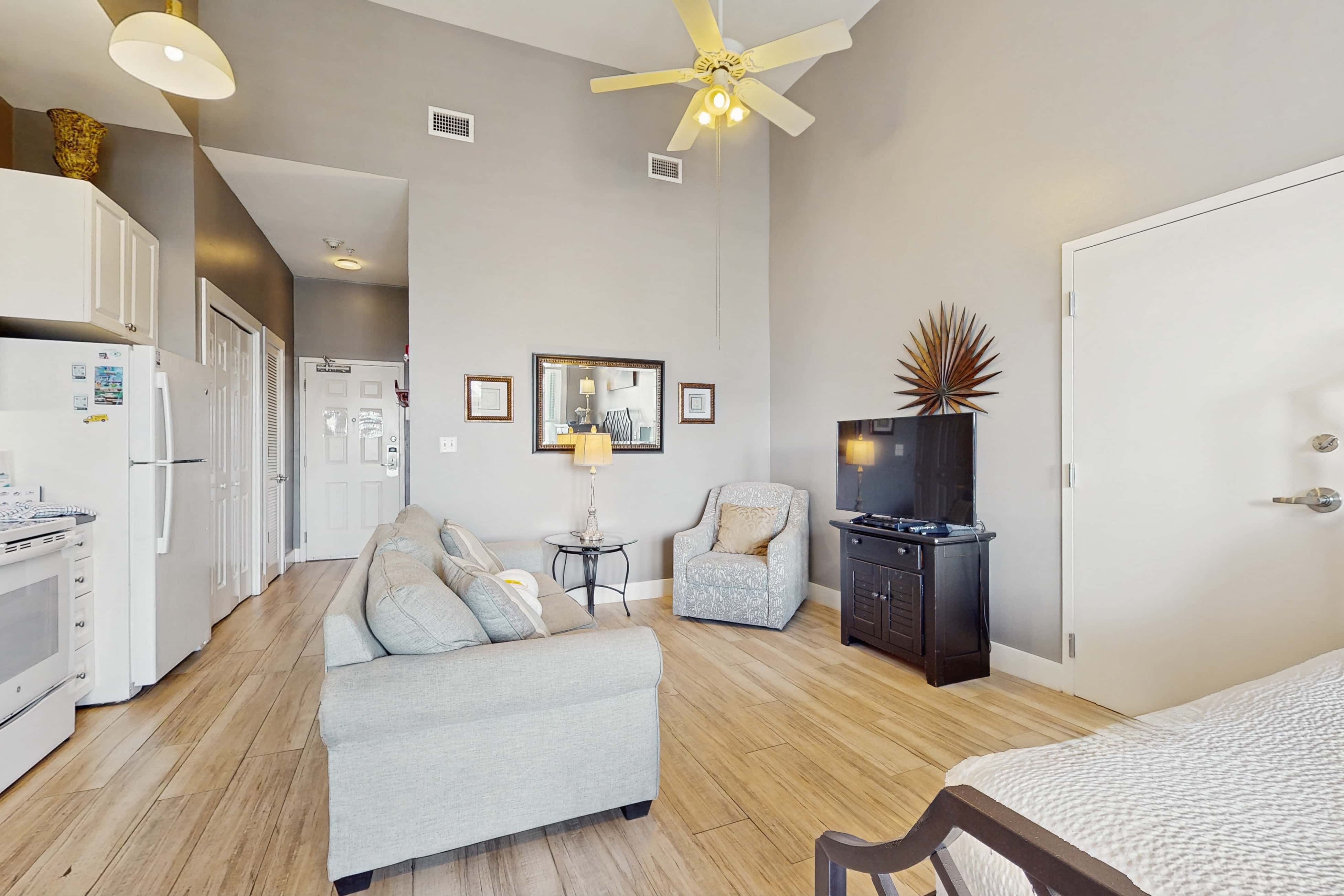 Spacious condo with large living area, private balcony & shared pool