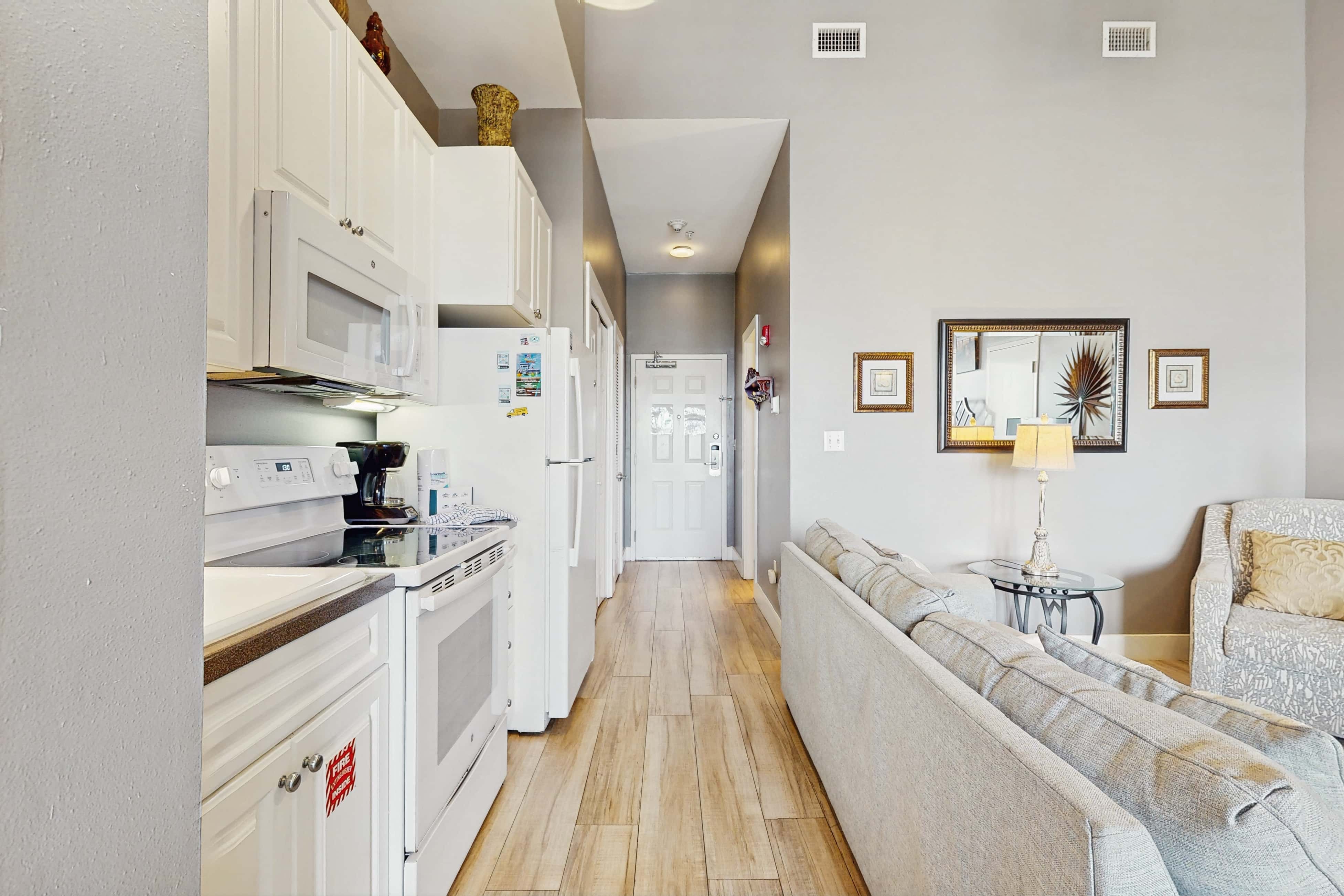 Spacious condo with large living area, private balcony & shared pool
