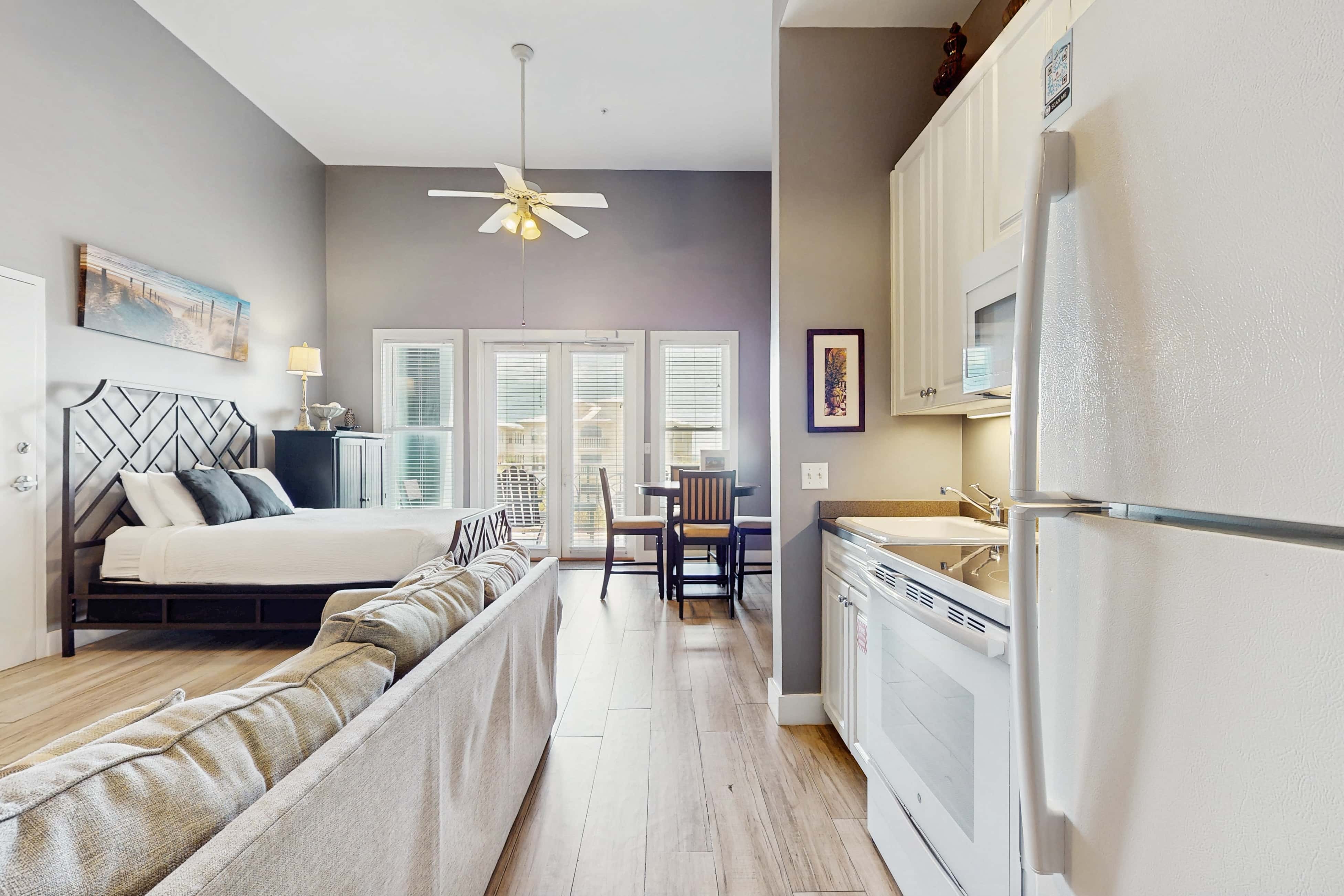 Spacious condo with large living area, private balcony & shared pool