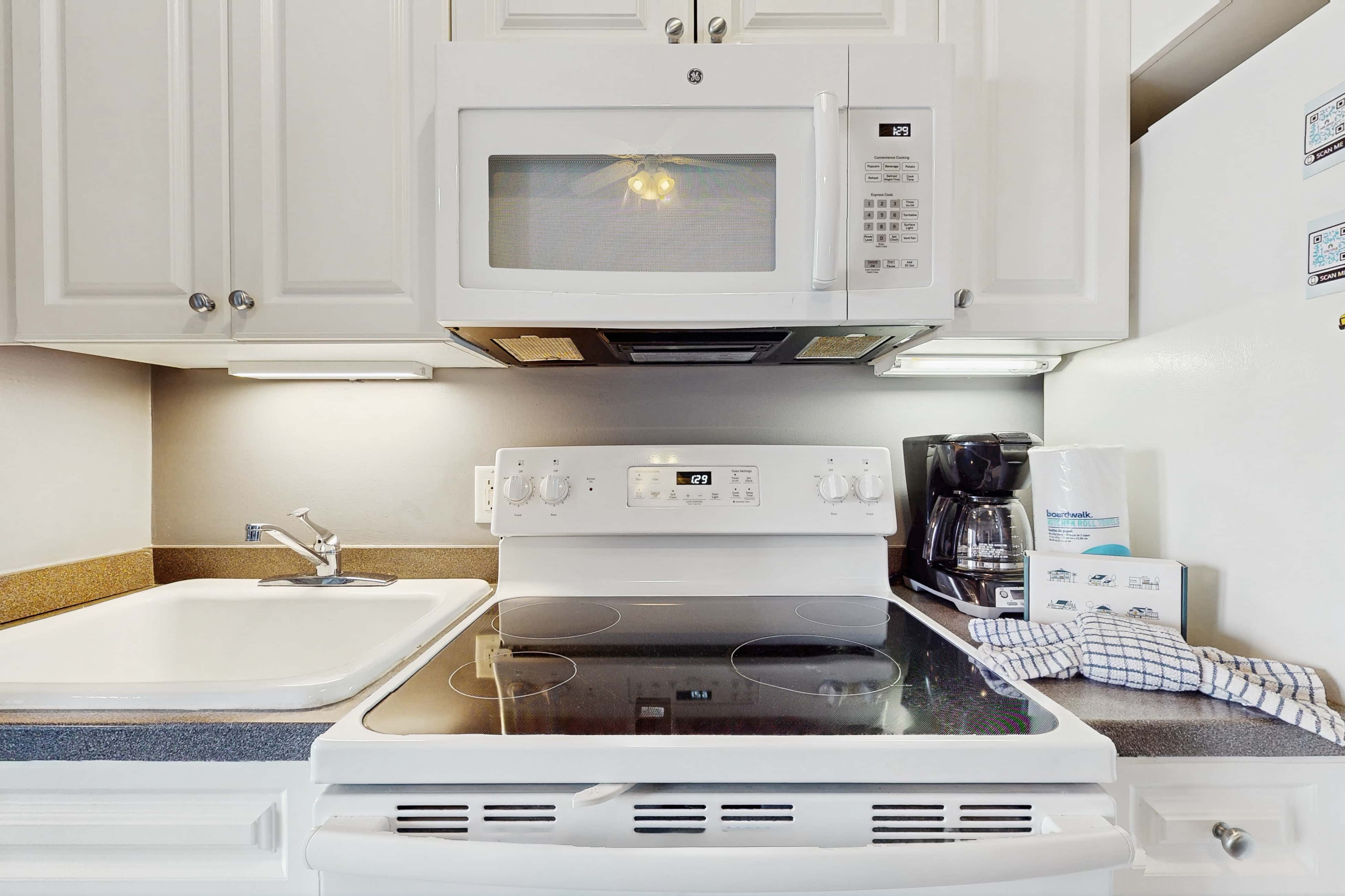 Spacious condo with large living area, private balcony & shared pool