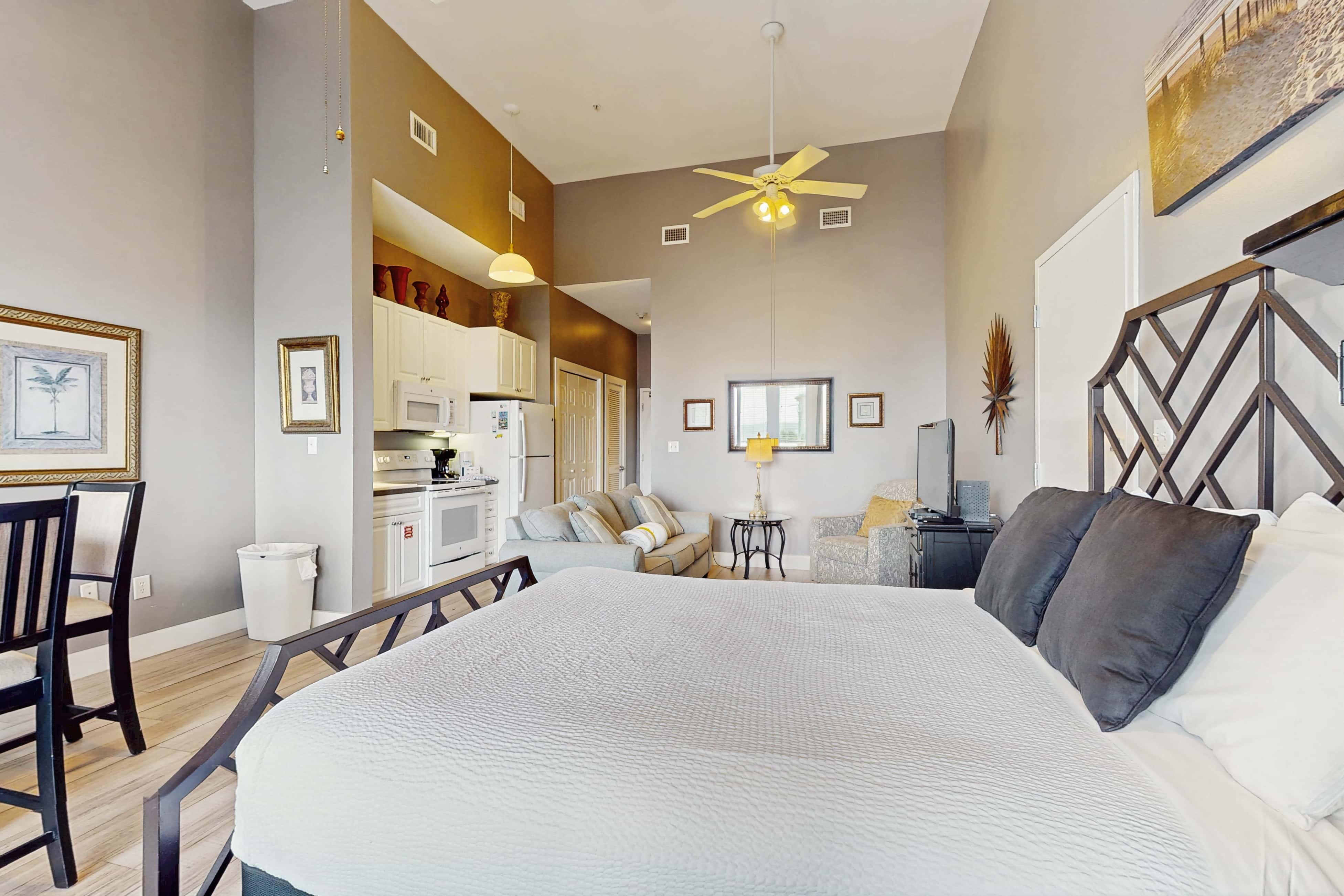Spacious condo with large living area, private balcony & shared pool