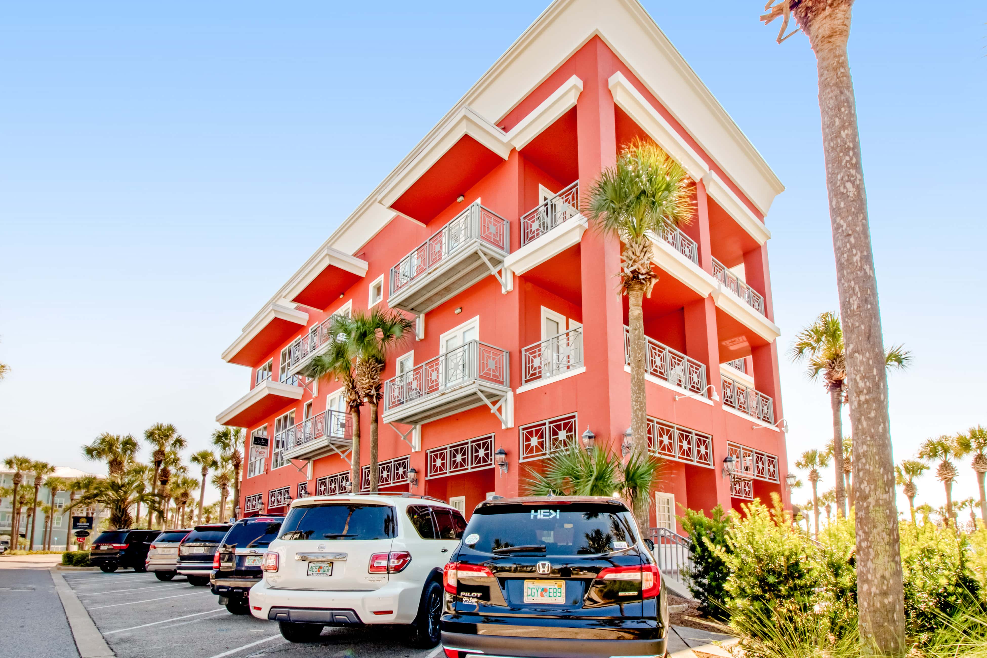 Spacious condo with large living area, private balcony & shared pool