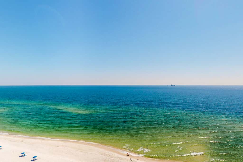 Inviting Gulf front condo In Perdido Key with waterfront pool and hot tub and oceanfront balcony