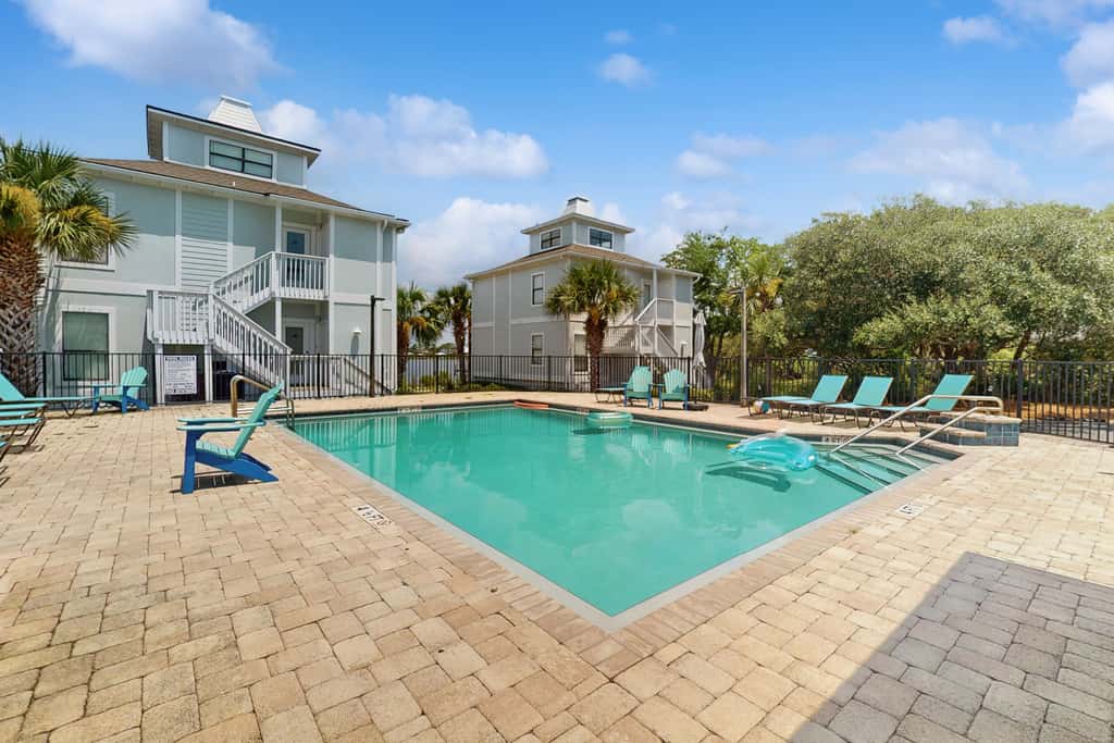 Gorgeous coastal townhome with private balcony, porch, WD,  and shared pool