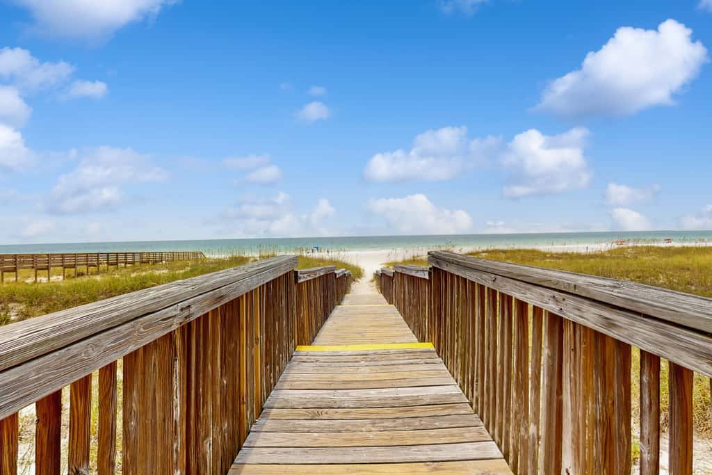Gorgeous coastal townhome with private balcony, porch, WD,  and shared pool