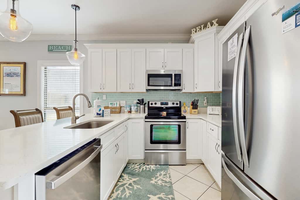 Gorgeous coastal townhome with private balcony, porch, WD,  and shared pool