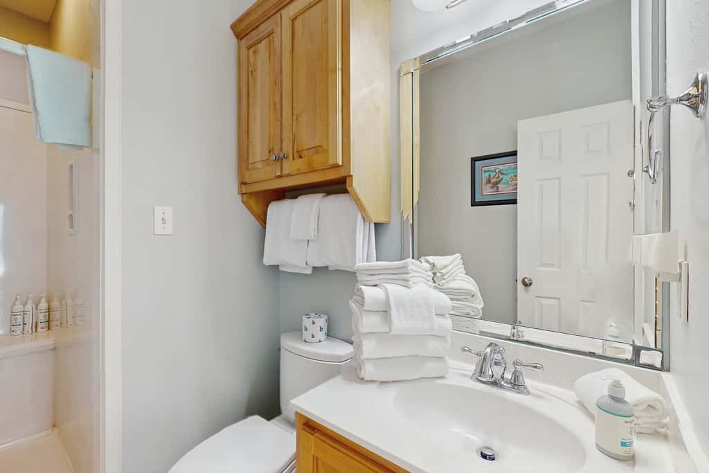 Gorgeous coastal townhome with private balcony, porch, WD,  and shared pool
