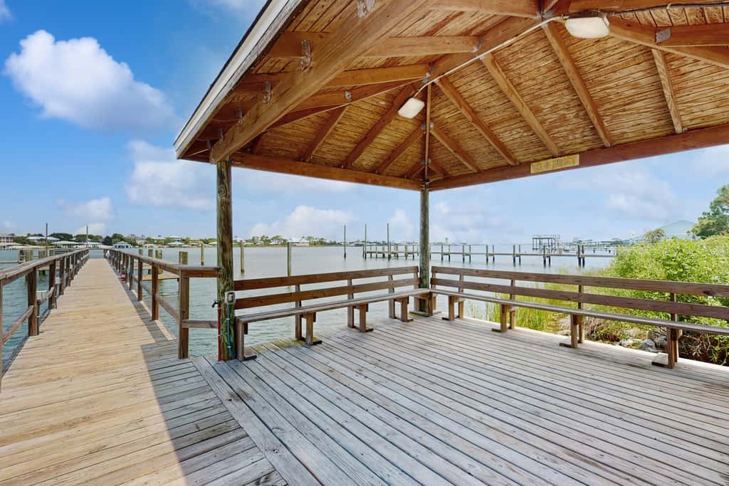 Gorgeous coastal townhome with private balcony, porch, WD,  and shared pool